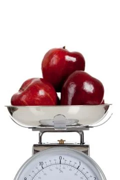 Fruit on a scale with a white background Stock Photos