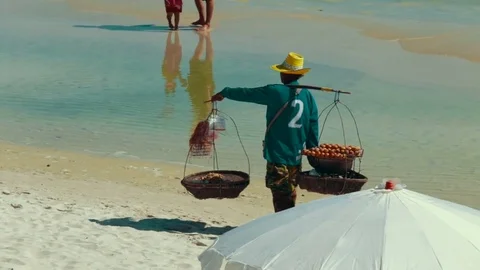 Fruit seller on the beach Stock Footage 72185727