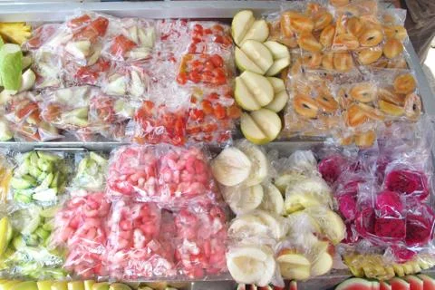 Fruit slice cut in piece in plastic bag pack on tray for sell at Penang Malay Stock Photos