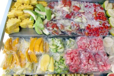 Fruit slice cut in piece in plastic bag pack on tray for sell at Penang Malay Photos