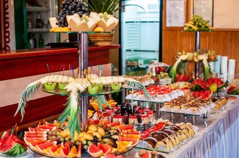 Fruit slicing at the wedding buffet Stock Photos