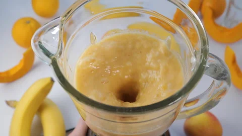 Fruit smoothie blended in blender Stock Footage 166547039