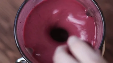 Fruit smoothie in a blender Video stock 73920425