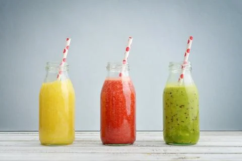 Fruit smoothies in retro bottles Stock Photos