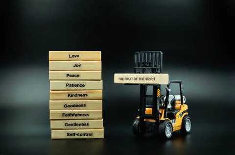 The Fruit Of The Spirit Stack Block Forklift lifting Up Title Block Stock Photos