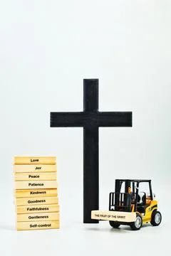 The Fruit of The Spirit Stack Dark Cross With Forklift Stock Photos