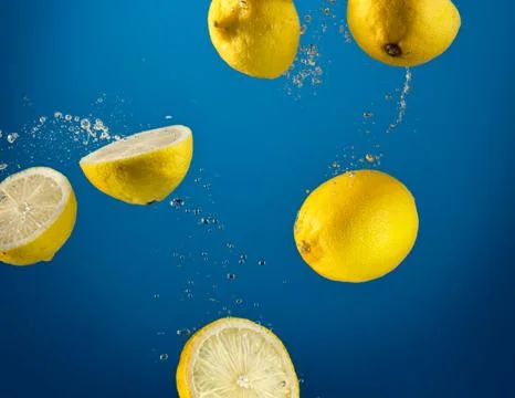 Fruit splash in to water. Stock Photos