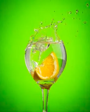 Fruit splashes in wine glasses Stock Photos