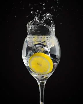Fruit splashes in wine glasses Stock Photos