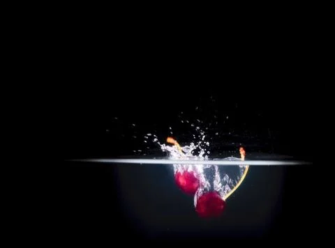 Fruit Splashing into water. Stock Photos