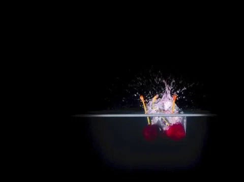 Fruit Splashing into water. Stock Photos
