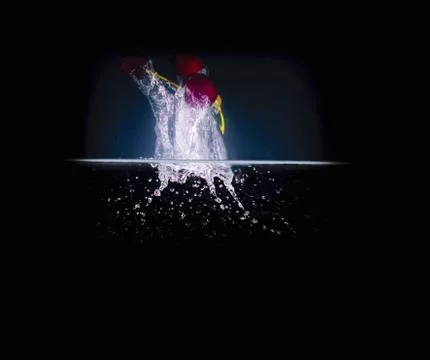 Fruit Splashing into water. Stock Photos