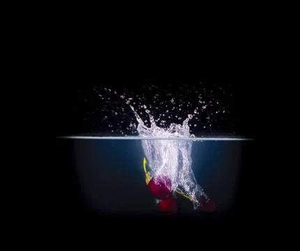 Fruit Splashing into water. Stock Photos