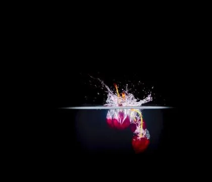 Fruit Splashing into water. Stock Photos
