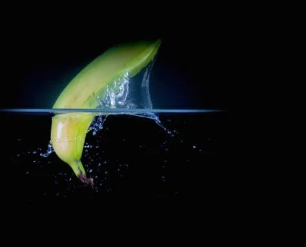 Fruit Splashing into water. Stock Photos