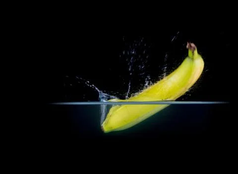 Fruit Splashing into water. Stock Photos