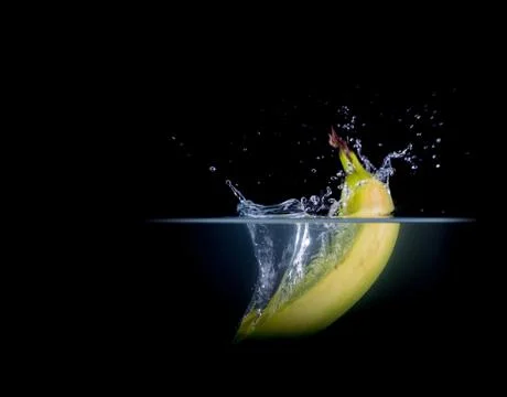 Fruit Splashing into water. Stock Photos