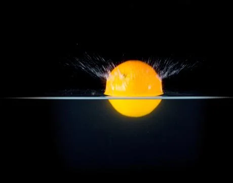 Fruit Splashing into water. Stock Photos