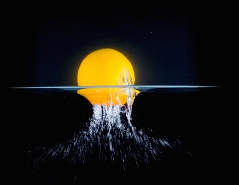 Fruit Splashing into water. Stock Photos