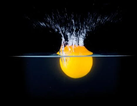 Fruit Splashing into water. Stock Photos