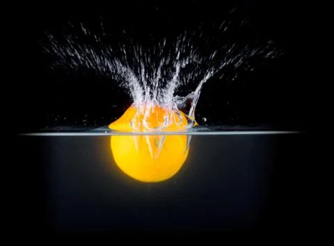 Fruit Splashing into water. Stock Photos
