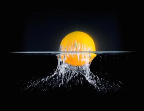 Fruit Splashing into water. Stock Photos