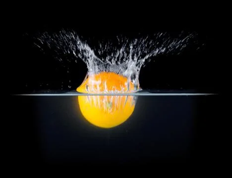 Fruit Splashing into water. Stock Photos