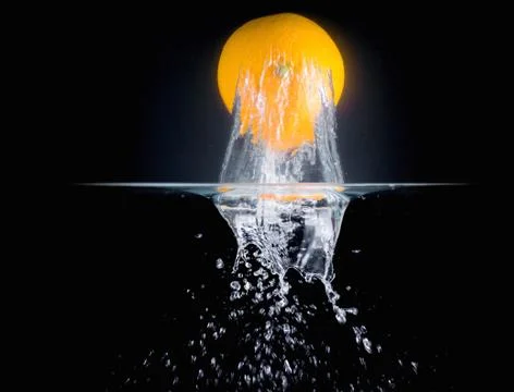 Fruit Splashing into water. Stock Photos