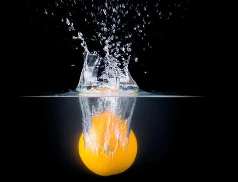 Fruit Splashing into water. Stock Photos