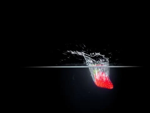 Fruit Splashing into water. Stock Photos