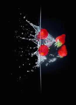 Fruit Splashing into water. Stock Photos