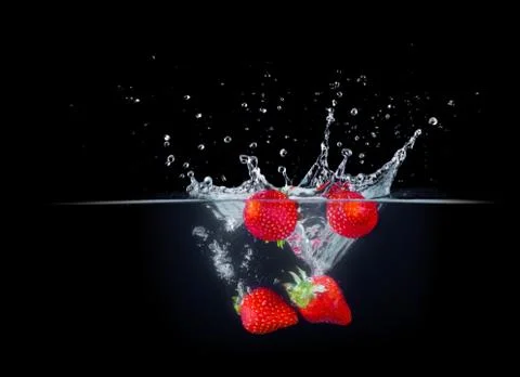 Fruit Splashing into water. Stock Photos