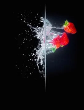 Fruit Splashing into water. Stock Photos