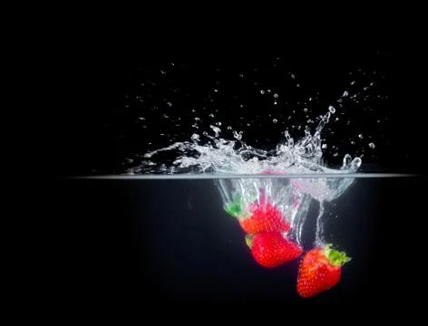 Fruit Splashing into water. Stock Photos
