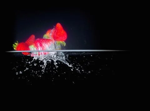 Fruit Splashing into water. Stock Photos