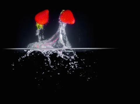 Fruit Splashing into water. Stock Photos