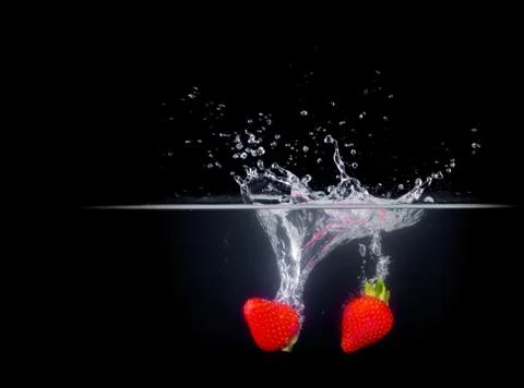 Fruit Splashing into water. Stock Photos