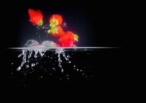 Fruit Splashing into water. Stock Photos