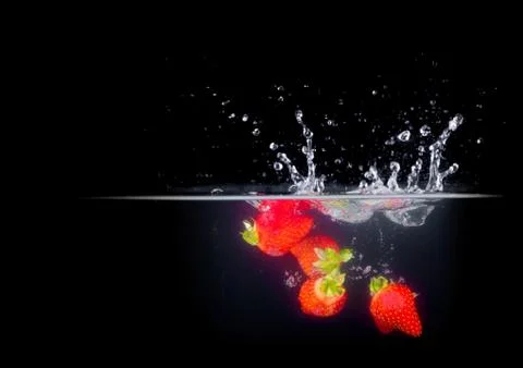 Fruit Splashing into water. Stock Photos