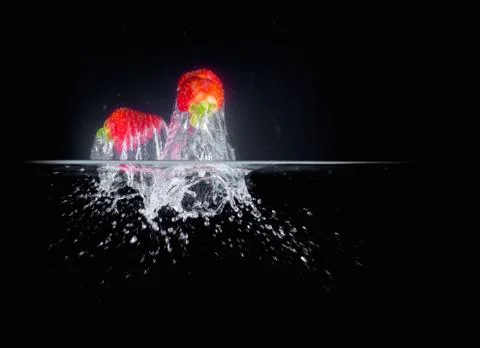 Fruit Splashing into water. Stock Photos
