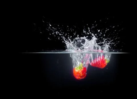 Fruit Splashing into water. Stock Photos