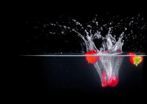 Fruit Splashing into water. Stock Photos