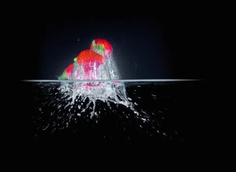 Fruit Splashing into water. Stock Photos