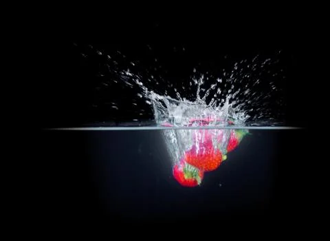 Fruit Splashing into water. Stock Photos