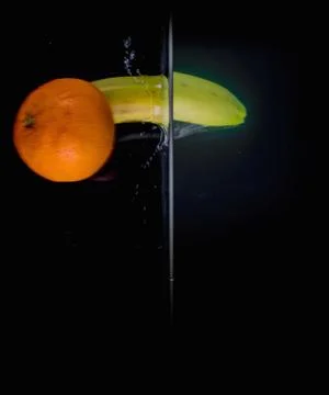 Fruit Splashing into water. Stock Photos