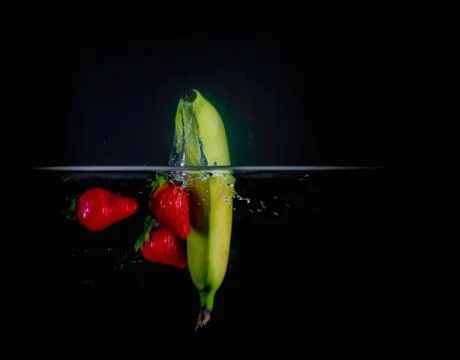 Fruit Splashing into water. Stock Photos