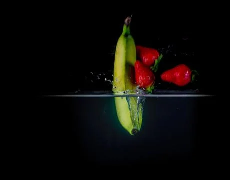 Fruit Splashing into water. Stock Photos
