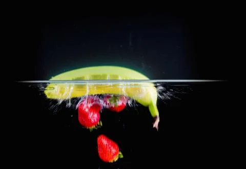 Fruit Splashing into water. Stock Photos