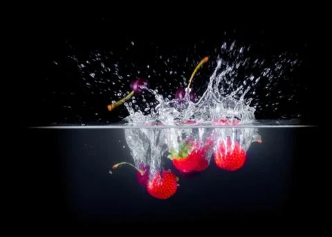 Fruit Splashing into water. Stock Photos