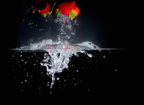 Fruit Splashing into water. Stock Photos